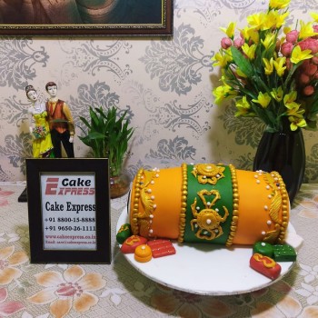 Orange Dhol Shape Fondant Cake