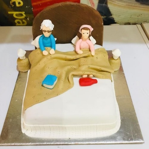 Old Parents in Bed Theme Cake Delivery in Faridabad